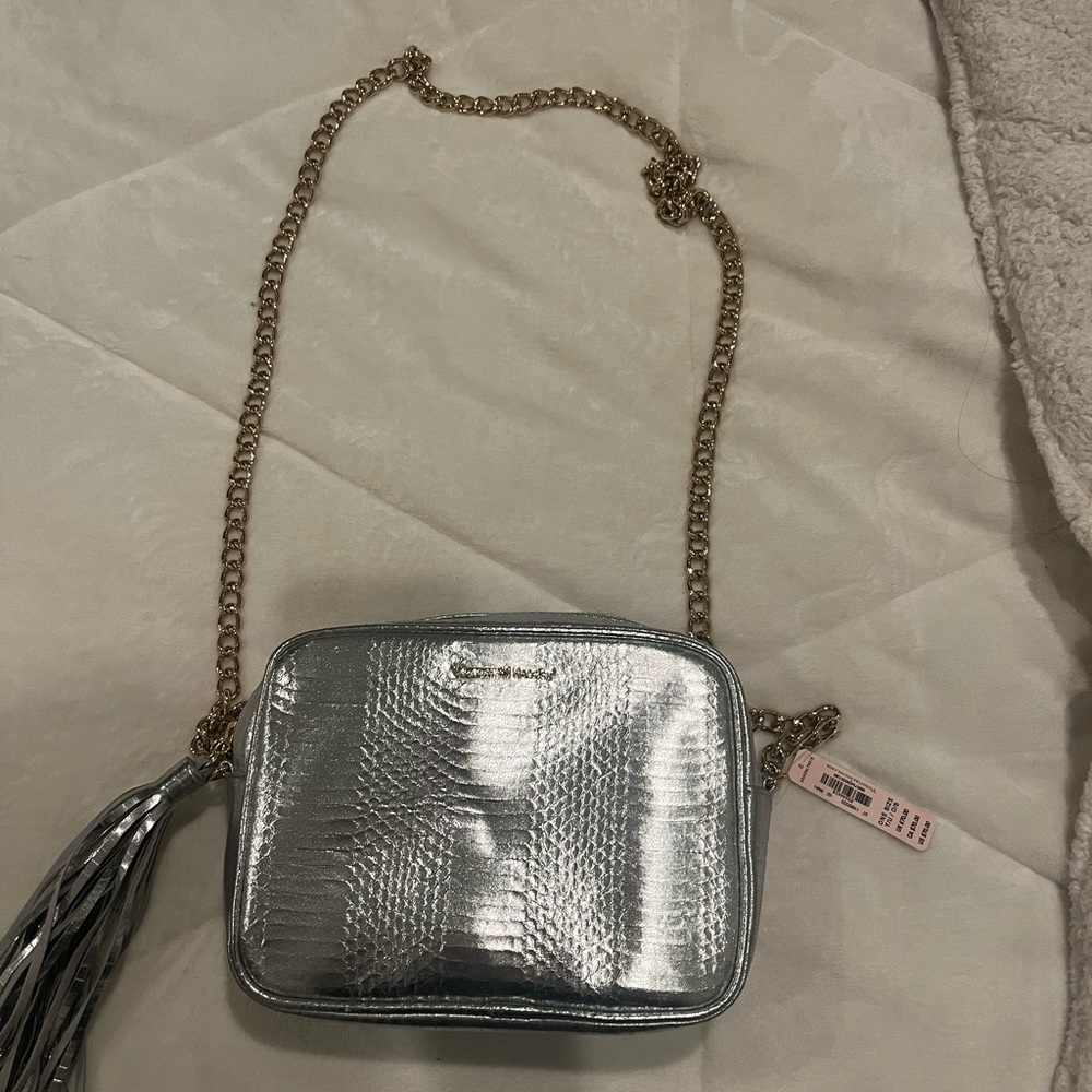 Bundle fun mini shoulder bags. Silver one is new with tag attached .